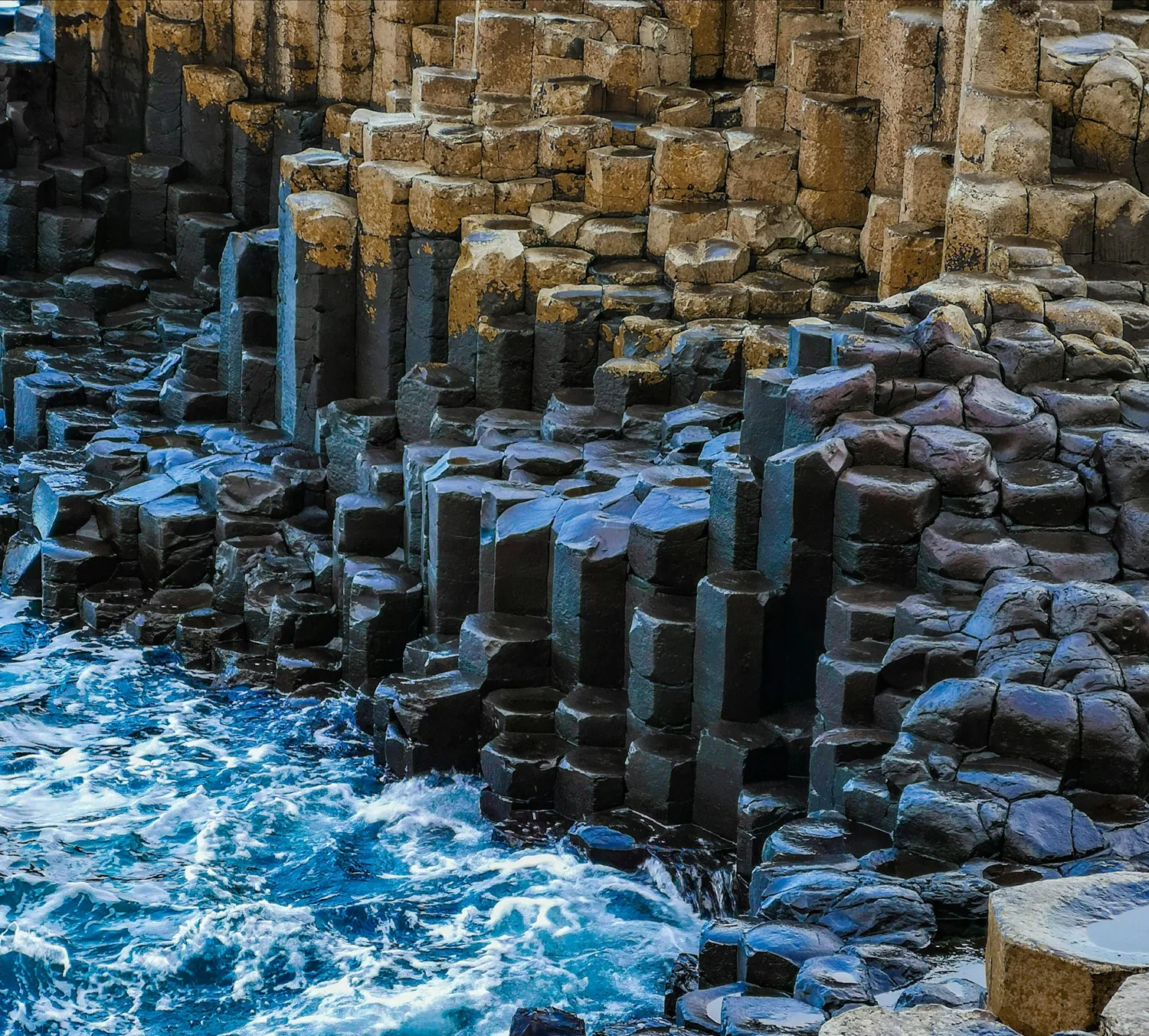 Basalt stones and waves at the Giant’s Causeway in Northern Ireland